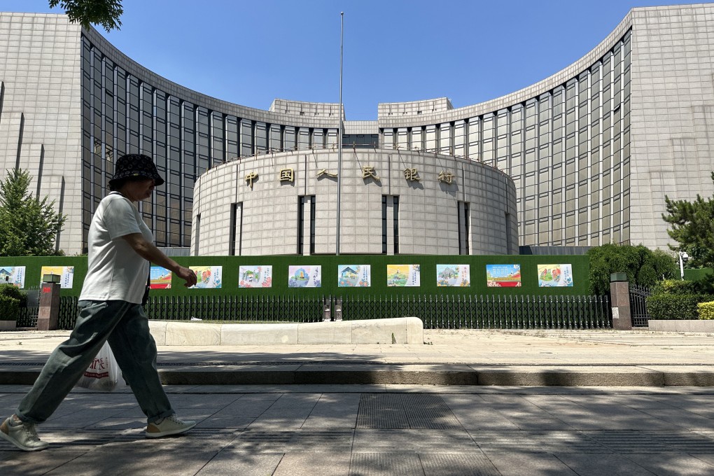 A citizen walks past the building of People’s Bank of China. Photo: VCG via Getty Images