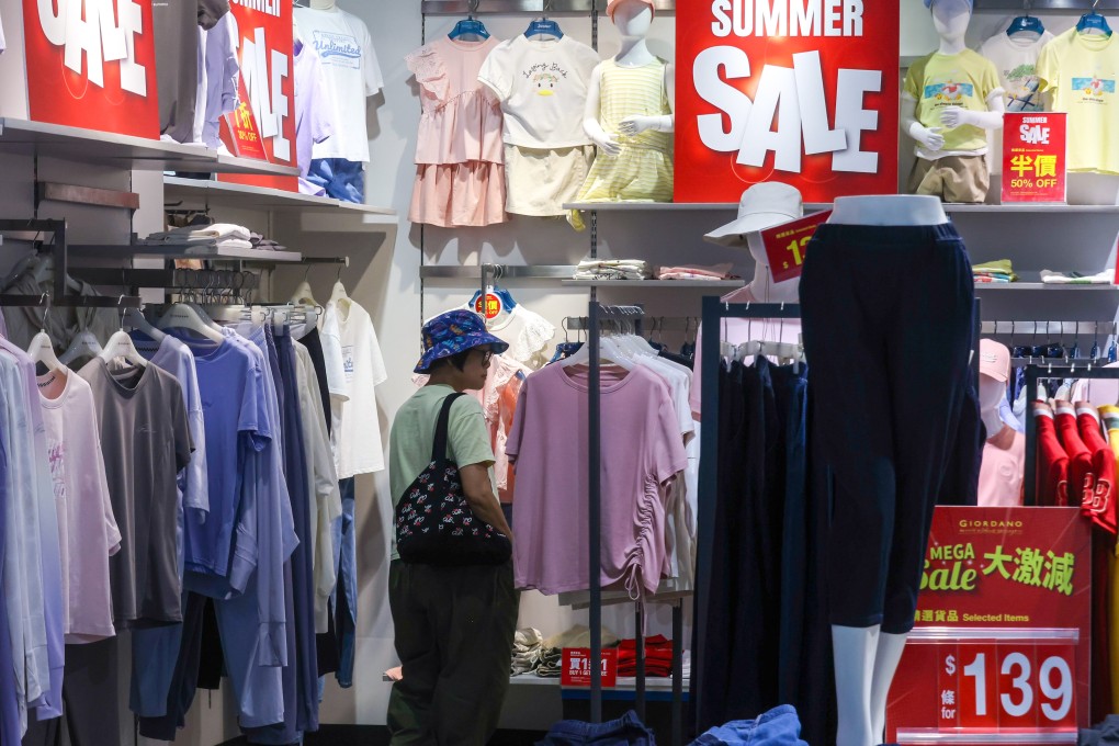 A shopper browses clothes in Yau Tong. Photo: Jonathan Wong