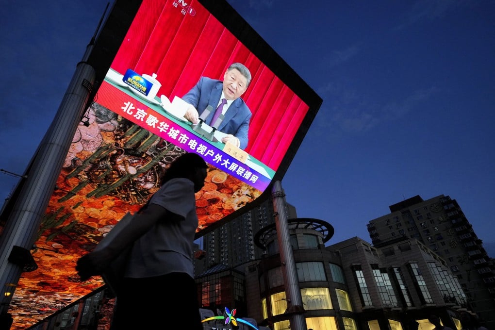 A large screen in Beijing shows President Xi Jinping making a speech at a memorial event marking the 120th anniversary of the birth of the late Chinese leader Deng Xiaoping. Photo: Kyodo