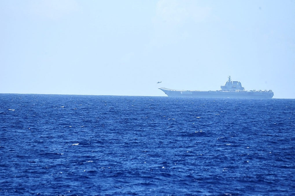A helicopter takes off from China’s Shandong aircraft carrier, over Pacific Ocean waters, south of Okinawa prefecture, Japan, in April last year. Photo: Handout via Reuters