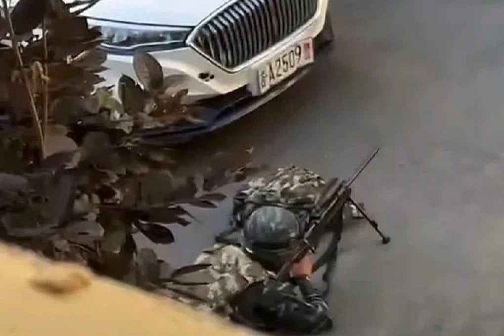 A police sniper lies in position during a deadly shoot-out in Changchun, Jilin province, on Monday. Photo: Handout
