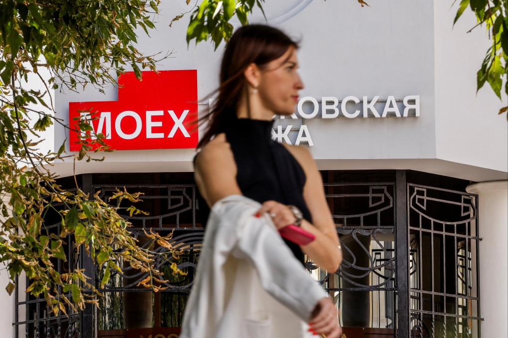 A pedestrian stands in front of an office of the Moscow Exchange, Russia’s leading financial marketplace, on August 5, 2024. Photo: Reuters