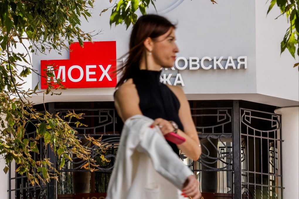 A pedestrian stands in front of an office of the Moscow Exchange, Russia’s leading financial marketplace, on August 5, 2024. Photo: Reuters