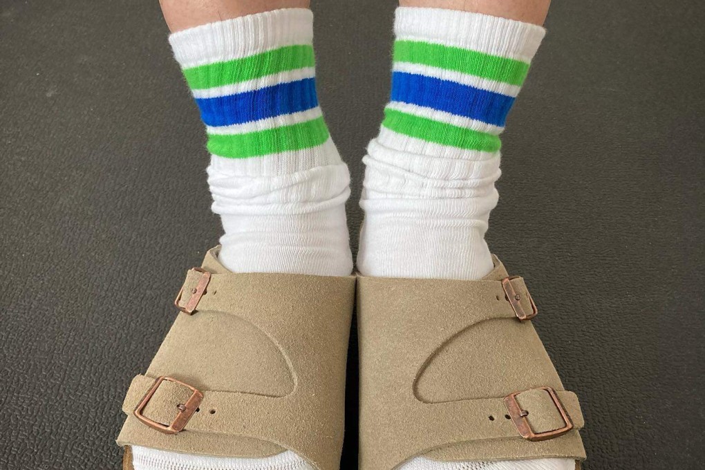 A pair of FamilyMart socks in its signature colours. Japanese convenience stores are becoming must-visit tourist spots for their fashion lines. Photo: Instagram/@t.sugi23