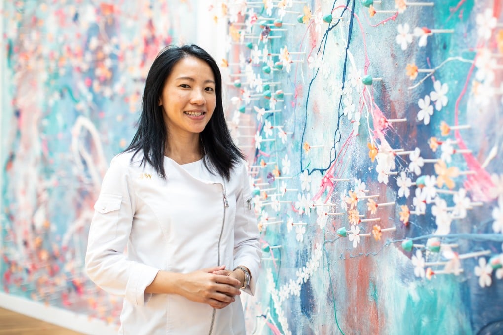 Singaporean pastry chef Janice Wong with one of her edible chocolate art walls, which have stimulated eyes and taste buds at Louis Vuitton shows and, more recently, two Marriott-owned resorts in Fiji. Photo: courtesy of Janice Wong