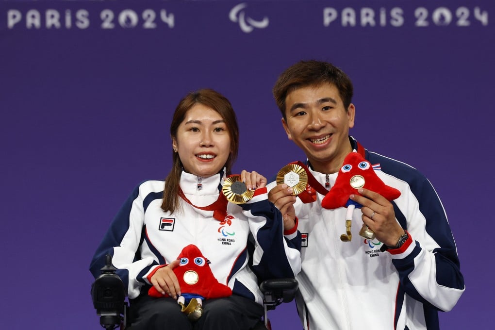 Boccia gold medallists Ho Yuen-kei and husband Lee Wing-kit pose during the medal ceremony for the women’s individual BC3 final. Photo: Reuters