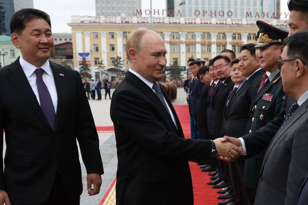 Russia’s President Vladimir Putin and Mongolia’s President Ukhnaagiin Khurelsukh attend an official welcoming ceremony in Ulaanbaatar on September 3. Photo: Pool/AFP