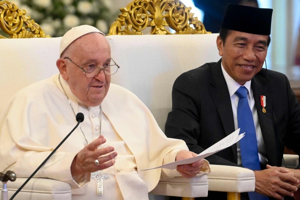 Pope Francis (left) delivers his address as Indonesia’s President Joko Widodo looks on during a meeting with Indonesian authorities, at the Presidential Palace in Jakarta on Wednesday. Photo: Vatican Media/AFP