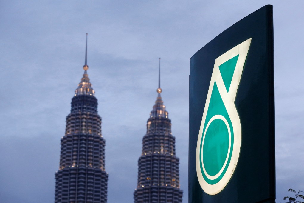 The logo of is seen with the Petronas Twin Towers in Kuala Lumpur. Petronas operates oil and gas fields in the South China Sea within Malaysia’s economic zone and has in recent years had several encounters with Chinese vessels. Photo: Reuters