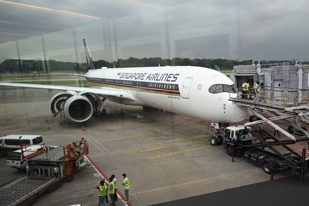 Technicians check a Singapore Airlines Airbus A350 aircraft at Changi International Airport. Photo: AFP