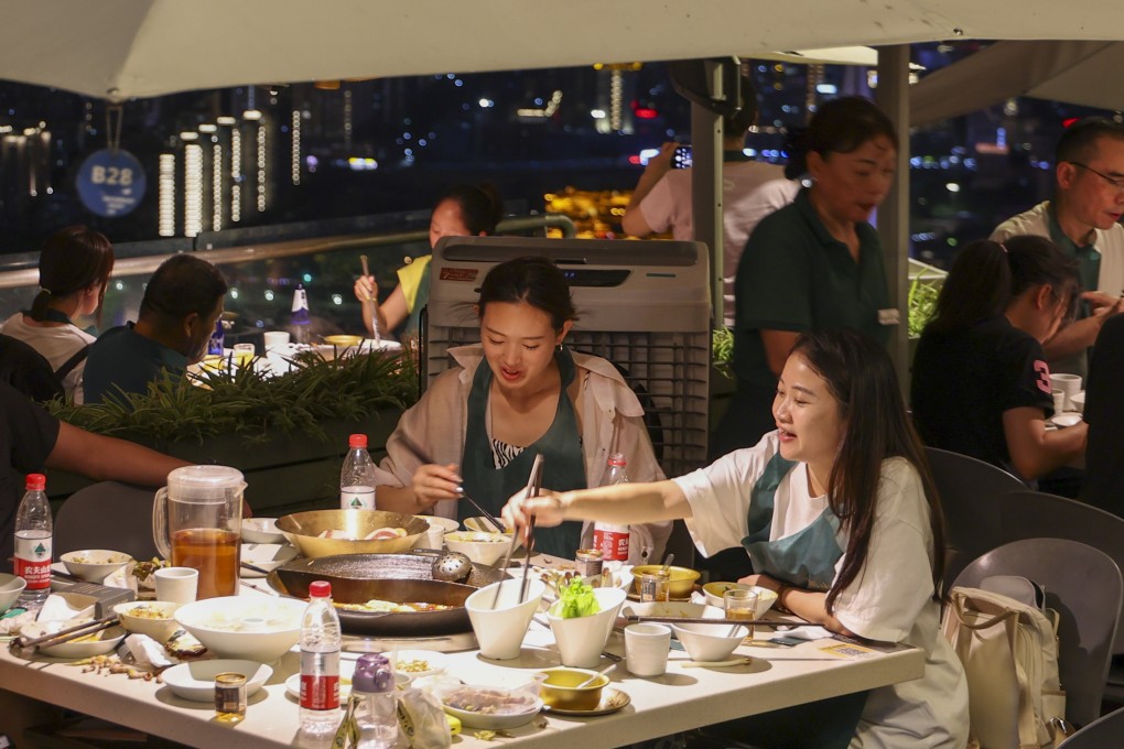 Tourists enjoy Chongqing hotpot in a restaurant at the Nanshan scenic spot. Photo: Xinhua
