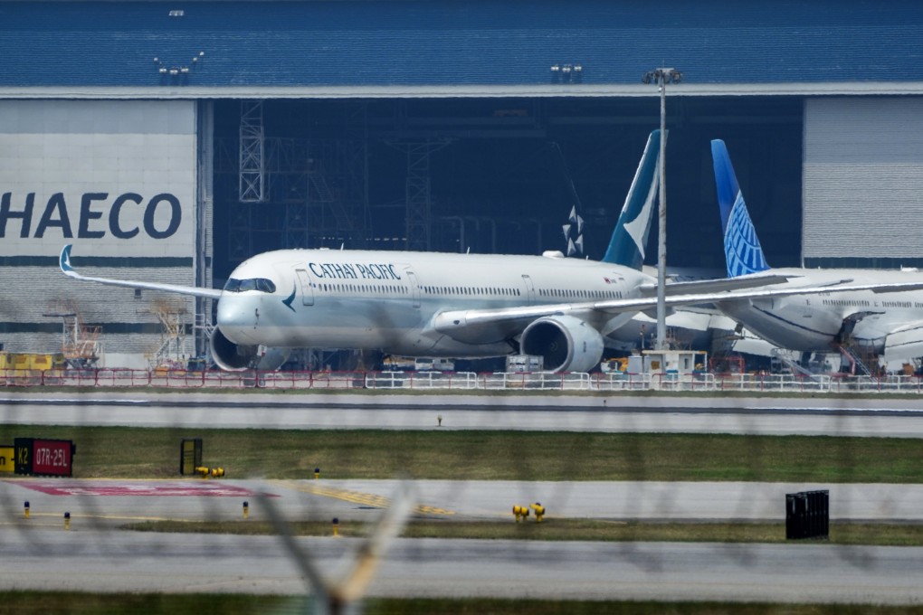 A Cathay Pacific Airbus A350 is parked outside a hanger at Hong Kong International Airport. Photo: Sam Tsang