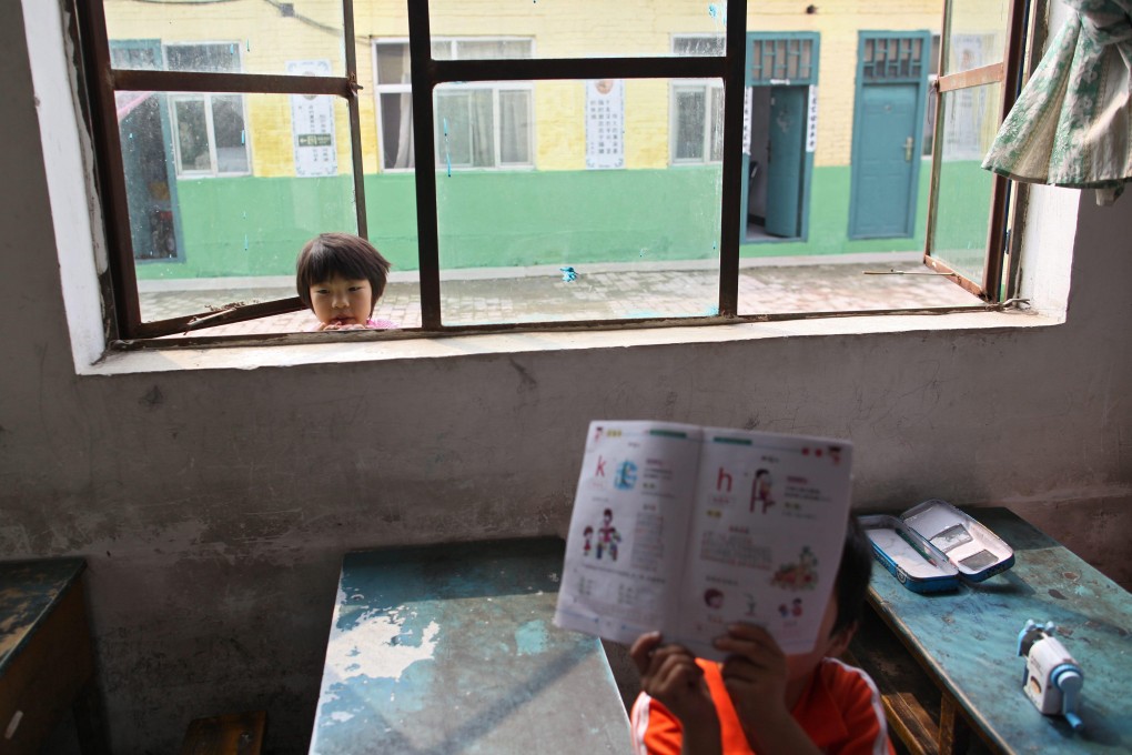 China is compiling a database of children whose parents leave their hometown for long stretches in search of work. Photo: EPA