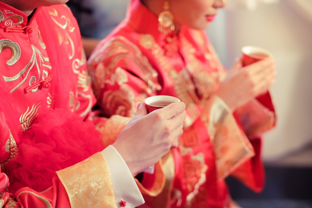 Chinese wedding attendees hold cups as part of a traditional tea ceremony. We look at why pouring tea is an important nuptial ritual, which wedding dates are considered unlucky in Chinese culture, and more. Photo: Shutterstock