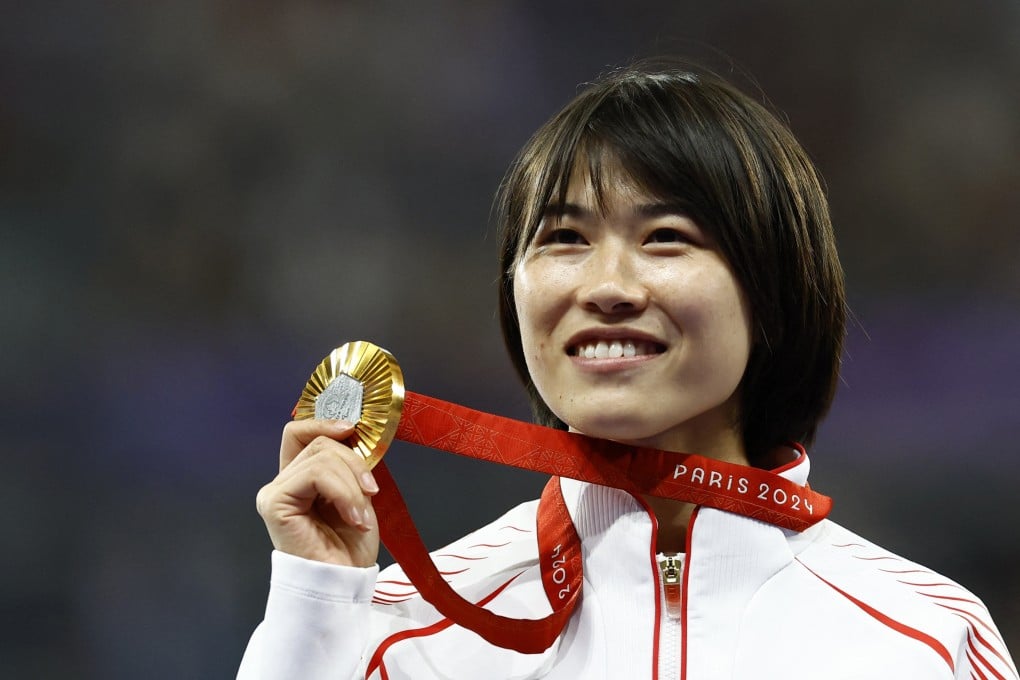Gold medallist Shi Yiting celebrates winning the women’s T36 100m at the Stade de France. Photo: Reuters