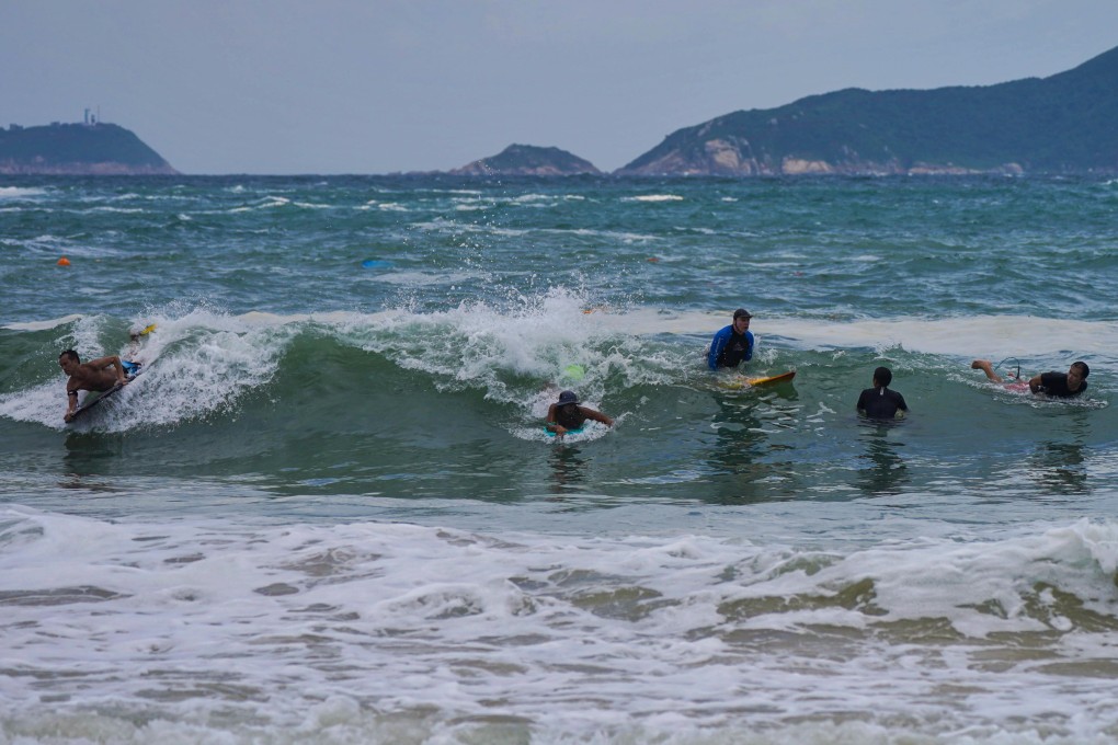 Surfers at Shek O Beach on Thursday. Photo: Elson Li