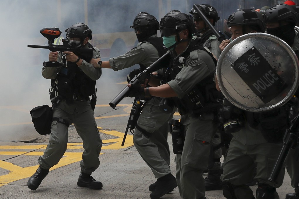 Riot police fire tear gas near Sogo department store in Causeway Bay, in response to anti-government protests in May 2019. Sam Tsang