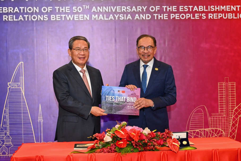 Chinese Premier Li Qiang and Malaysian Prime Minister Anwar Ibrahim celebrate the 50th anniversary of diplomatic relations between the two countries in Kuala Lumpur in June. Photo: Xinhua