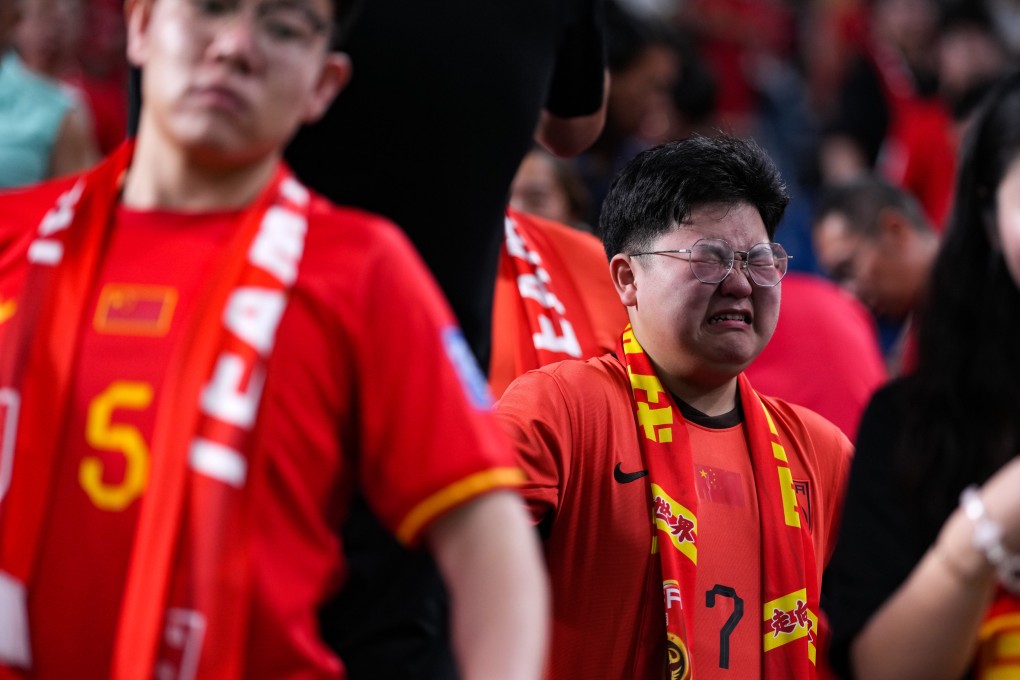 A Chinese fan reacts after his team’s “numbing” 7-0 loss to Asia’s top-ranked team in Saitama, Japan. Photo: Xinhua