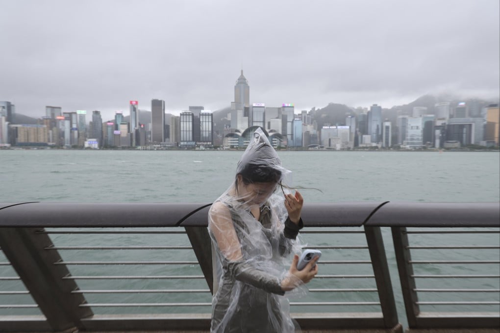 A woman stands near the waterfront in Tsim Sha Tsui as Super Typhoon Yagi nears Hong Kong. Photo: Dickson Lee