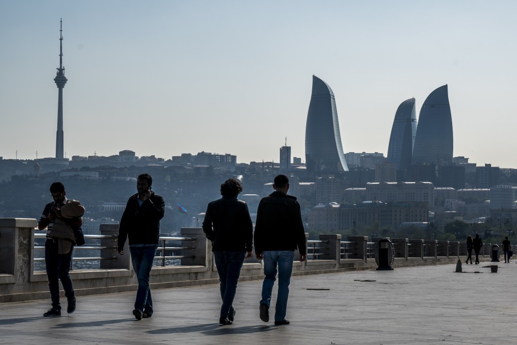 People walk along a Caspian seaside promenade, with the Flame Towers in the distance, in Baku, Azerbaijan, in April 2019. As Azerbaijan moves to join Brics, it must strike a cautious balance between its multipolar ambitions and existing connections with the West. Photo: EPA-EFE