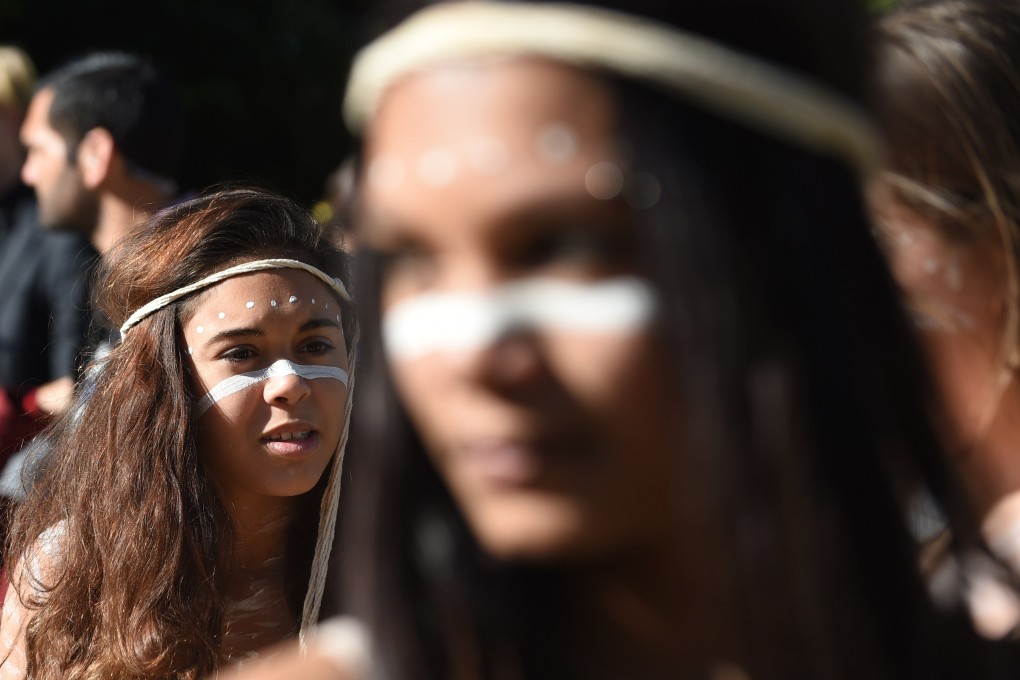 Indigenous Australian performers hold a smoking ceremony to open NAIDOC Week, a national programme that celebrates the National Aborigines and Islanders Day Observance Committee, in Sydney on July 6, 2015, which grew from the first political groups seeking rights for Aboriginal and Torres Strait Island Australians in the 1920s. Photo: AFP