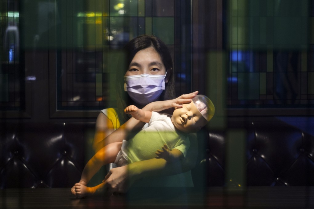 Little Suet-yee’s mother with a doll she ordered from Germany to better understand “shaken baby syndrome”. Photo: Eugene Lee