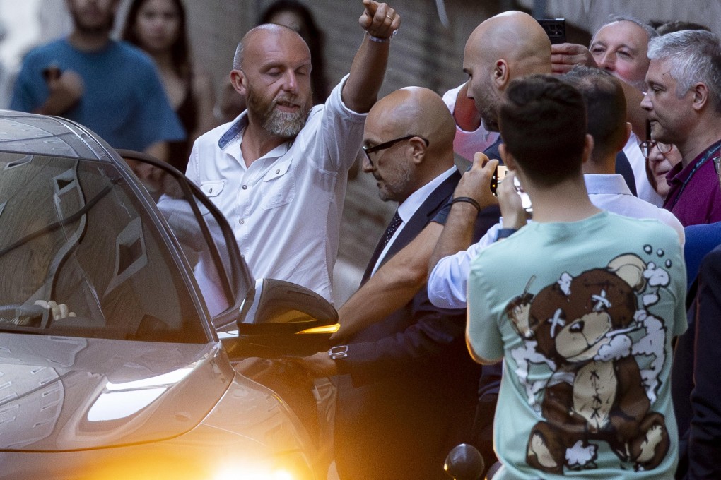 Former Italian culture minister Gennaro Sangiuliano (centre) leaves the ministry in Rome on Friday. Photo: EPA-EFE