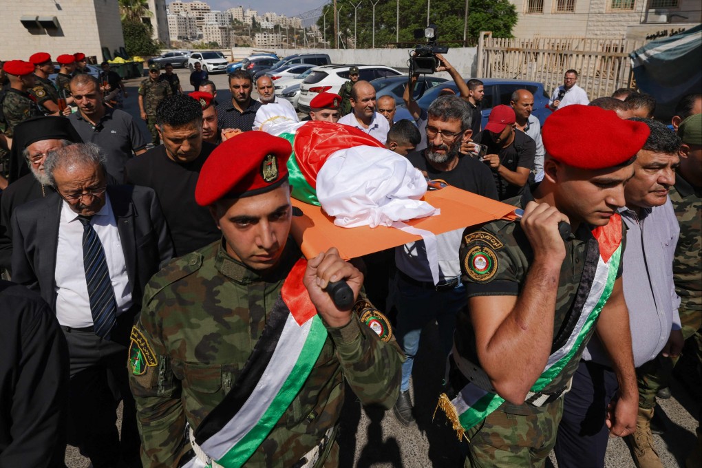 Members of the Palestinian security forces carry the body of 13-year-old Bana Bakr a day after she was shot and killed by Israeli forces in Qaryut in the occupied West Bank, according to the Palestinian health ministry, on September 7, 2024. Photo: AFP