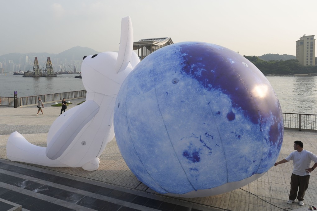 A worker tests a large inflatable Mid-Autumn Festival decoration at Cheung Sha Wan Promenade. Eugene Lee