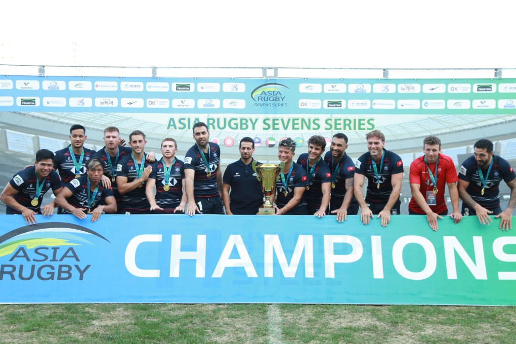 Hong Kong lift the men’s cup after the first leg in South Korea. Photo: Hong Kong China Rugby