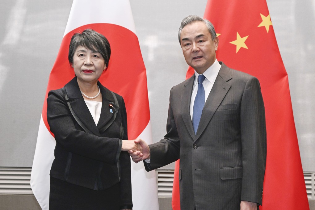Japanese Foreign Minister Yoko Kamikawa with Chinese counterpart Wang Yi. Photo: Kyodo