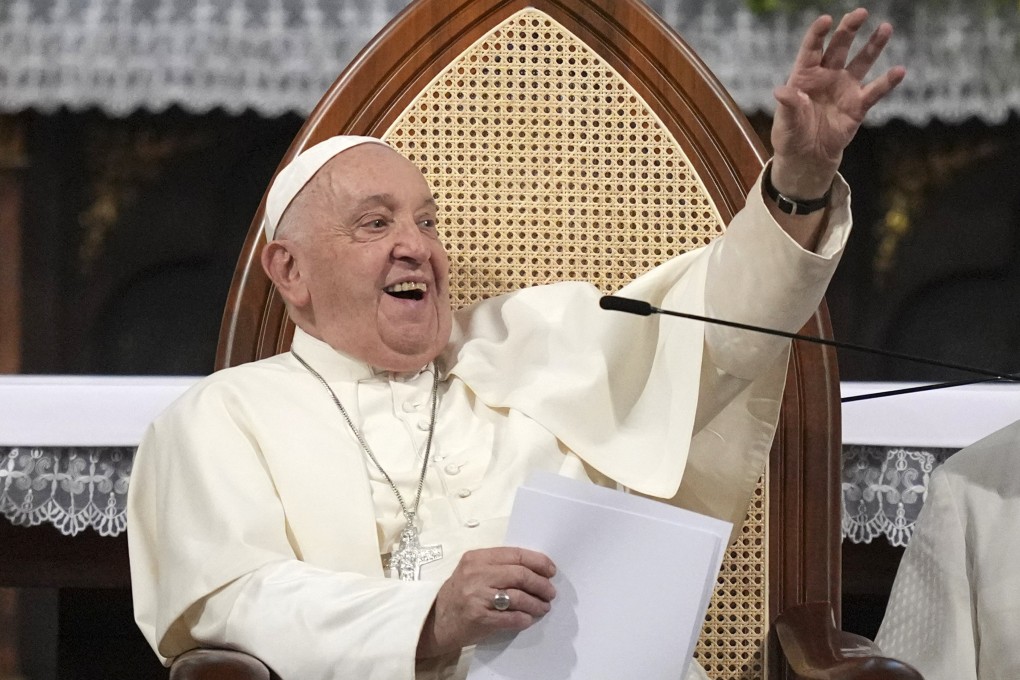 Pope Francis waves to members of the Catholic community at a cathedral in Jakarta last week. The pontiff is set to arrive in Singapore on Wednesday. Photo: EPA-EFE