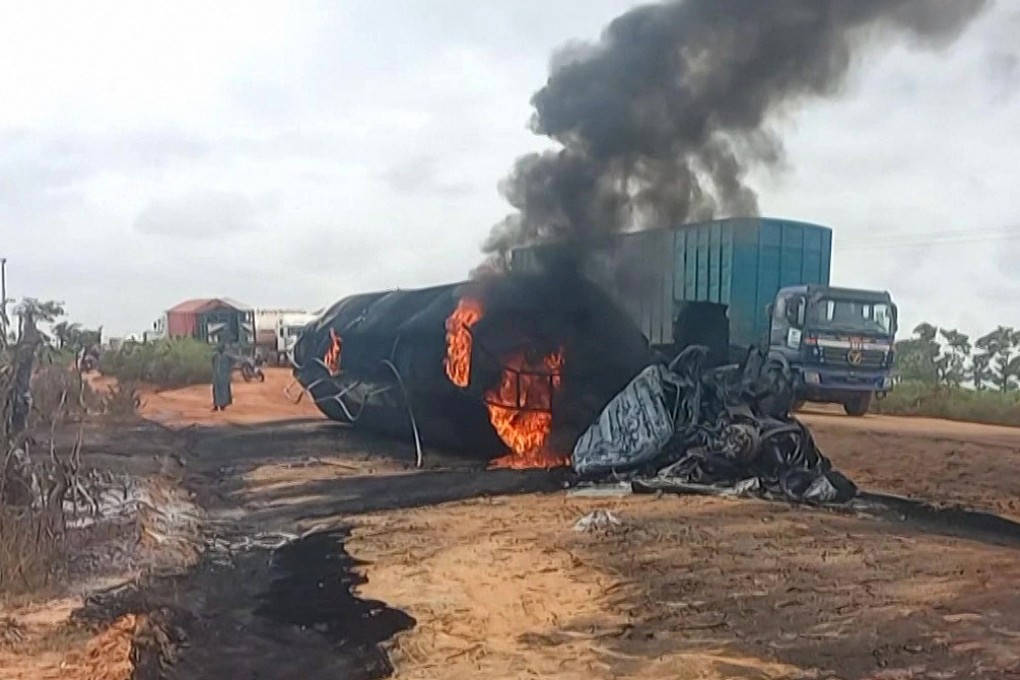 Flames and smoke billowing from a fuel tanker that exploded after colliding with a truck carrying passengers and cattle on September 8. Photo: Niger State Emergency Management Agency/AFP
