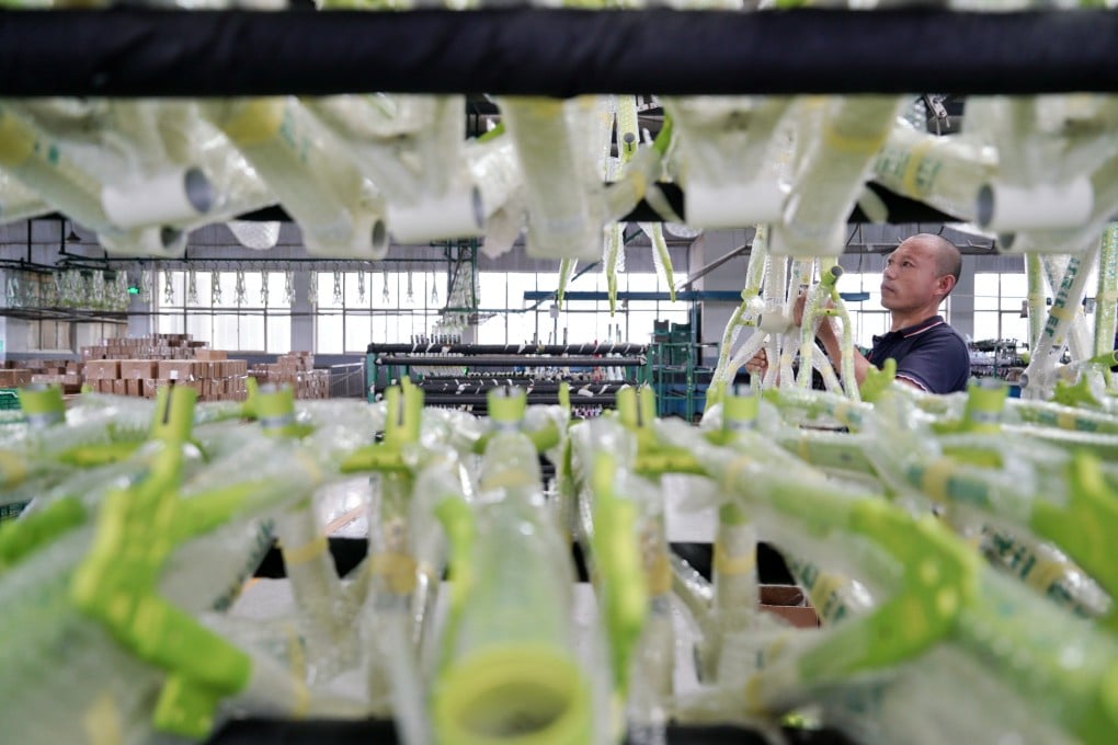 A worker moves a children bicycle frame at a children wheels factory in Pingxiang County, north China’s Hebei province. Photo: Xinhua