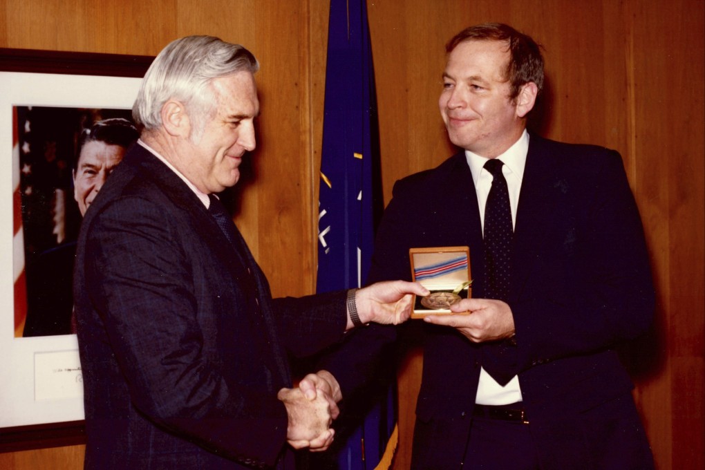 Edward B. Johnson, right, receives the CIA’s Intelligence Star from John N. McMahon, then the agency’s deputy director for operations, in 1980. File photo: Family of Edward B. Johnson / CIA via AP