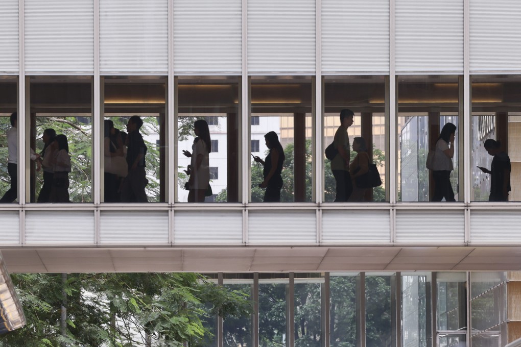 People walk on a footbridge in Central, Hong Kong’s financial district, on June 18. Photo: Jelly Tse