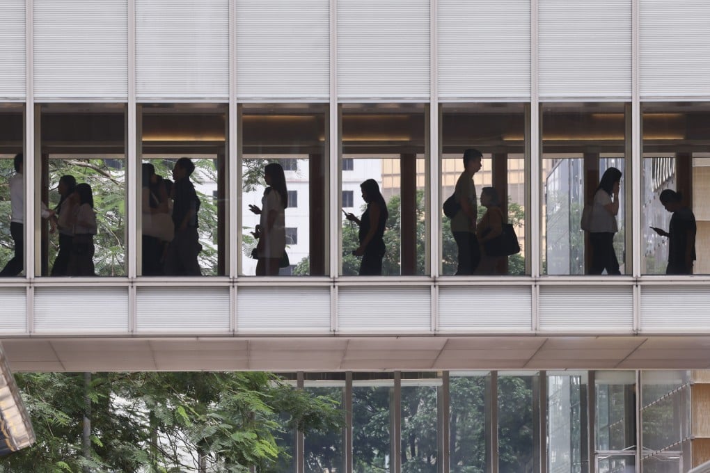 People walk on a footbridge in Central, Hong Kong’s financial district, on June 18. Photo: Jelly Tse