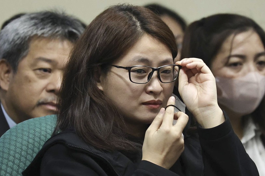 Dismissed Bamban Mayor Alice Guo, a fugitive recently arrested in Indonesia, holds her glasses during a Senate hearing on Monday. Photo: Philippine Senate Social Media Unit via AP