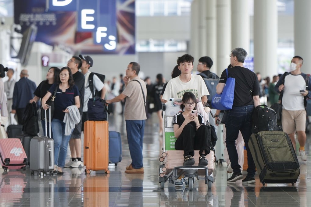 Passengers walks in the departure hall of Hong Kong International Airport. Photo: Sam Tsang