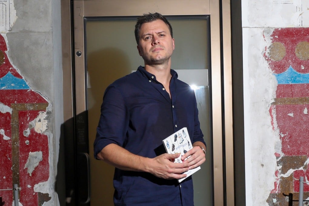 Daniel Bird holds a copy of his new book Sorry Men at Tai Kwun in Central, Hong Kong. The book takes aim at toxic masculinity in short stories about men who avoid vulnerability and honesty. Photo: Xiaomei Chen