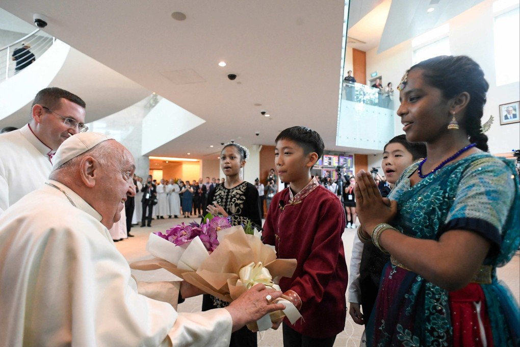Pope Francis is welcomed upon arrival at Changi airport in Singapore. Photo: AFP/Vatican Media