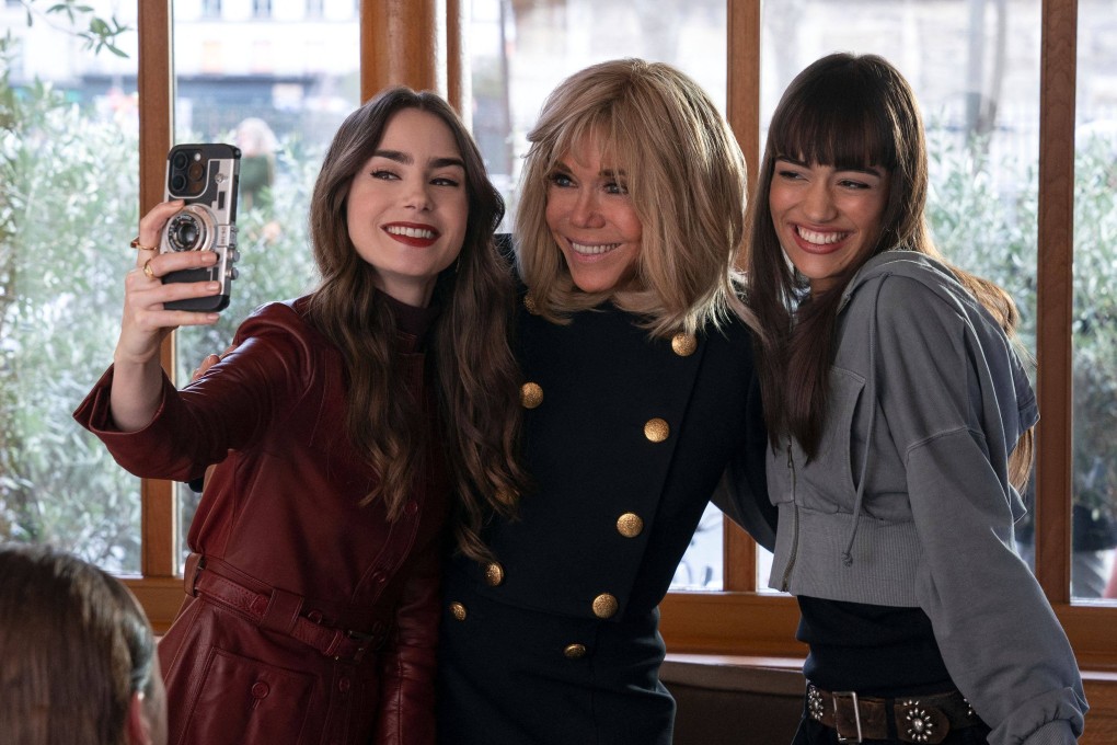 Brigitte Macron (centre) poses for a selfie with Emily in Paris stars Lily Collins (left) and Thalia Besson. The French first lady, who the Netflix show’s creator said has “great talent”, will make an appearance in an upcoming episode of season 4. Photo: AFP