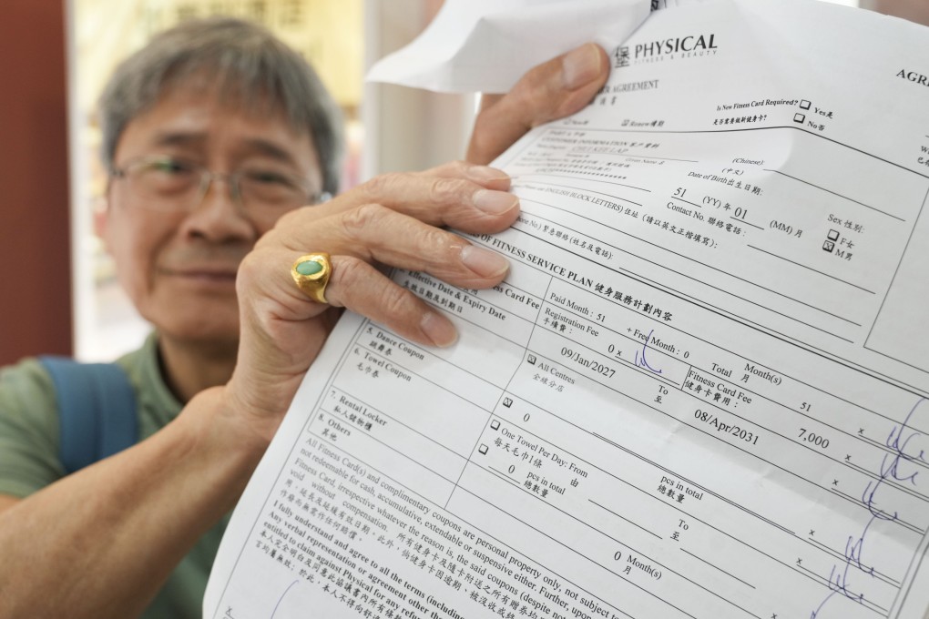 A former customer shows a contract with the gym chain. The total amount involved in complaints made to customs doubled in a day, surging to HK$71 million. Photo: Sam Tsang