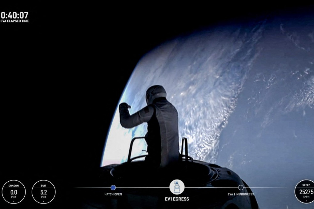 US fintech billionaire Jared Isaacman peeks out to space from a hatch structure. Photo: AFP