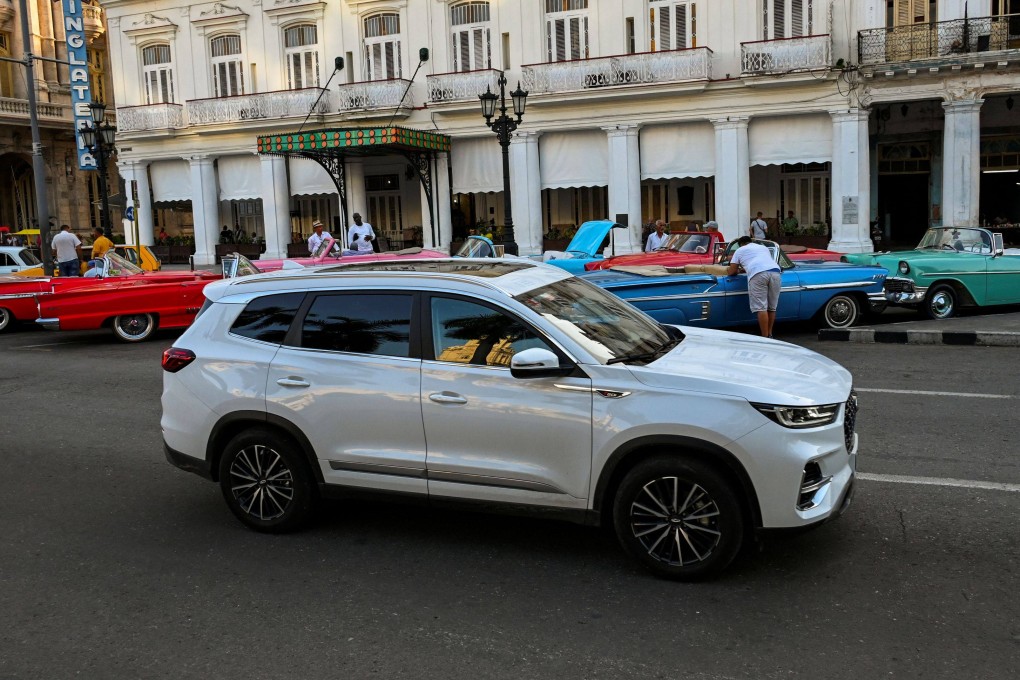 A Tiggo 8 car from Chinese brand Chery is driven past old American cars in Havana, Cuba. More luxury cars from Chinese, Japanese, Korean and US carmakers are appearing on Cuba’s streets after an easing of import restrictions. Photo: AFP