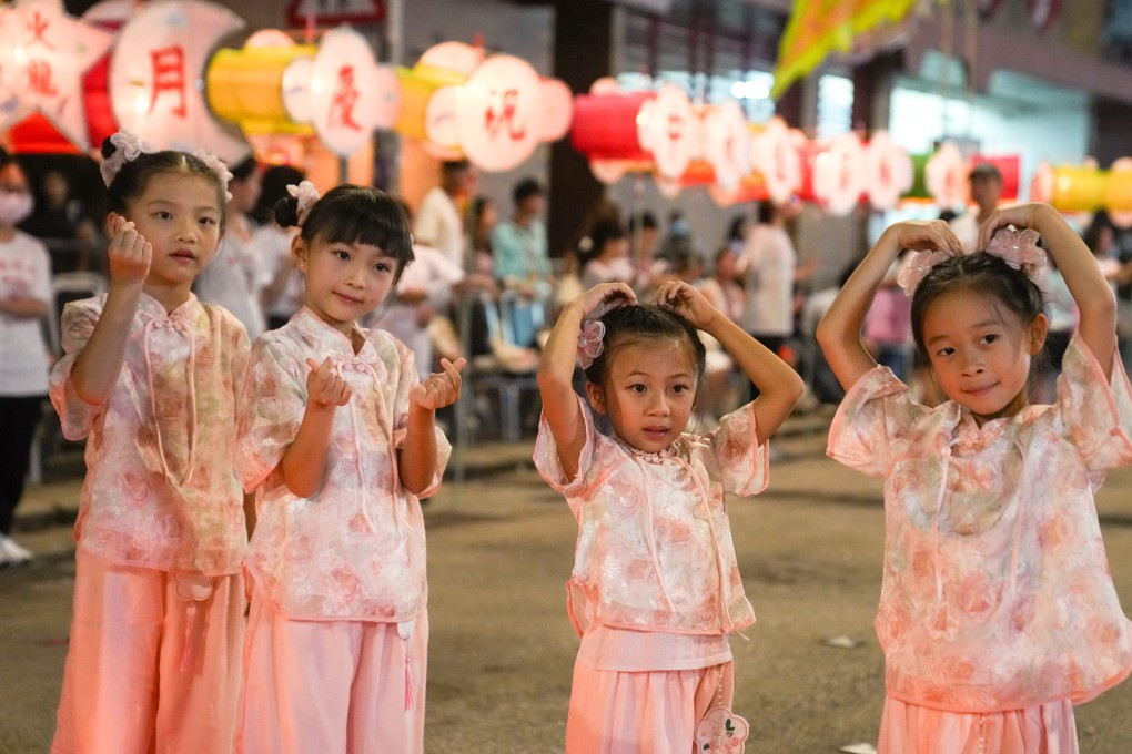 Children take part during the annual fire dragon dance parade in celebration of the Mid Autumn Festival in Tai Hang, Hong Kong, in 2023. You can buy souvenirs at this years event at the Tai Hang Fire Dragon Heritage Centre. Photo: Sam Tsang