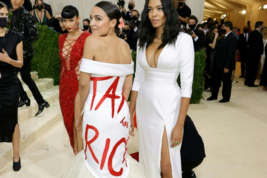 US congresswoman Alexandria Ocasio-Cortez, posing for a photo with fashion designer Aurora James, attends the Met Gala in New York City on September 13, 2021 wearing a dress printed with the words “tax the rich”. The slogan has been a rallying cry for Democrats as they seek to remake the social safety net in the US. Photo: Getty Images / AFP