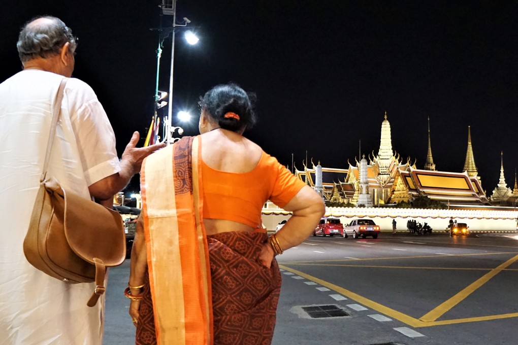 Indian tourists admire The Grand Palace in Bangkok, Thailand. Photo: Shutterstock