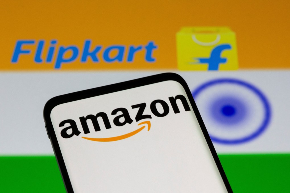 Smartphone with Amazon logo is seen in front of displayed Flipkart logo and Indian flag in this illustration. Photo: Reuters